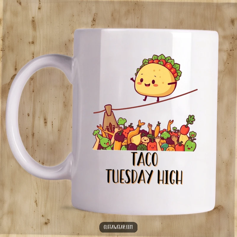 Funny Mug depicting a smiling taco balancing on a tightrope above cheering vegetables, a humorous foodie gift.