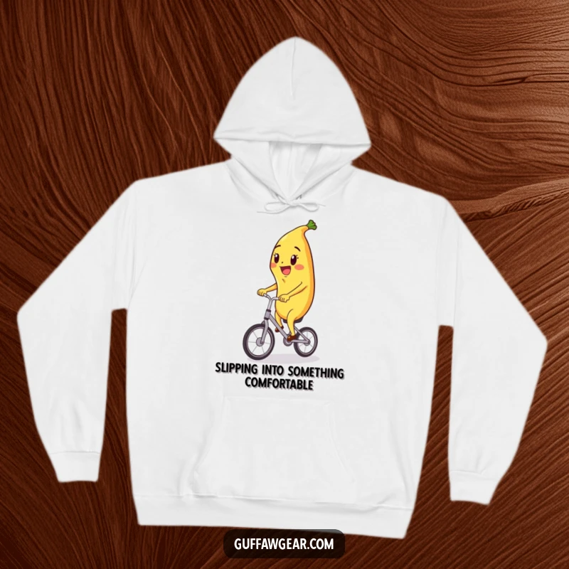 Funny hoodie depicting a joyful banana character riding a miniature unicycle, offering cozy comfort and whimsical fun.