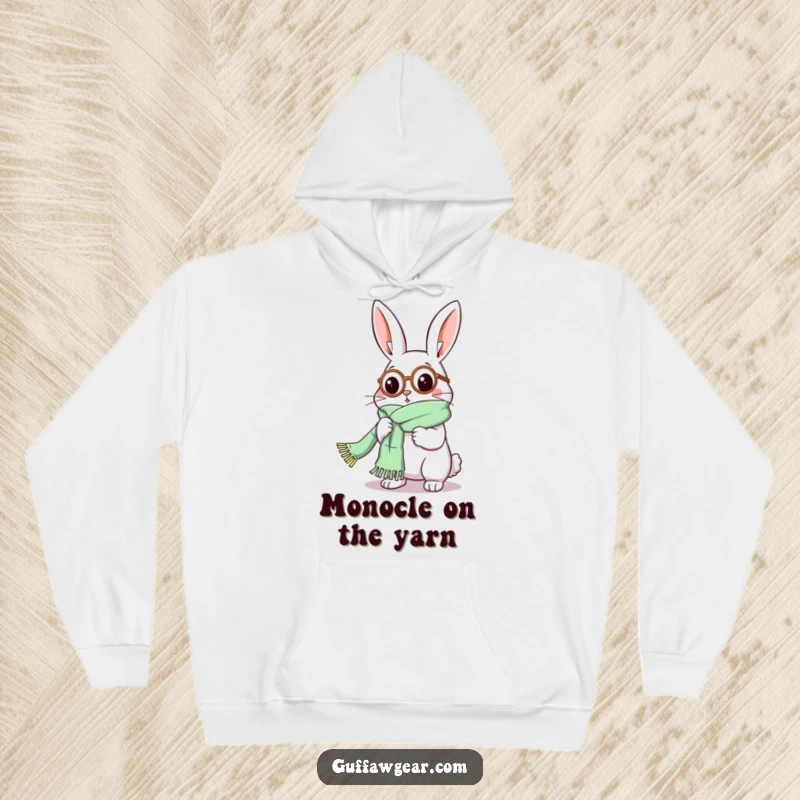 Funny Rabbit Hoodie: A dapper rabbit wearing a monocle comically knits a scarf that seems to have no end.