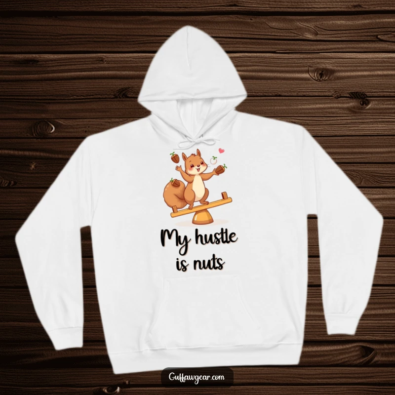 Funny and warm hoodie featuring a squirrel juggling acorns while perfectly balanced on a teeter-totter, ideal for cool weather.