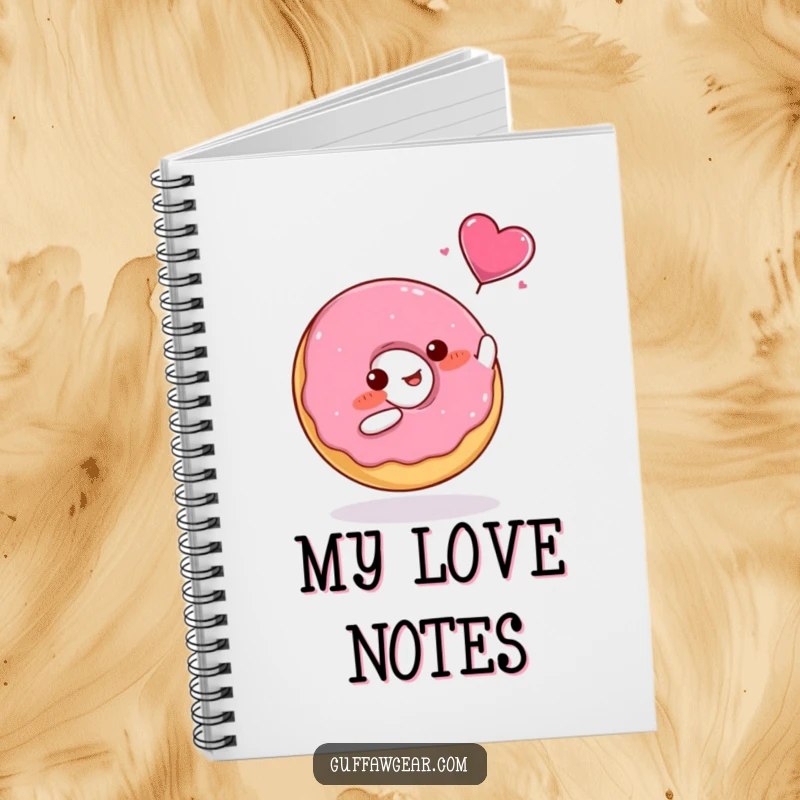 Funny Notebook with a blushing donut catching a flying candy heart, ideal for journaling.