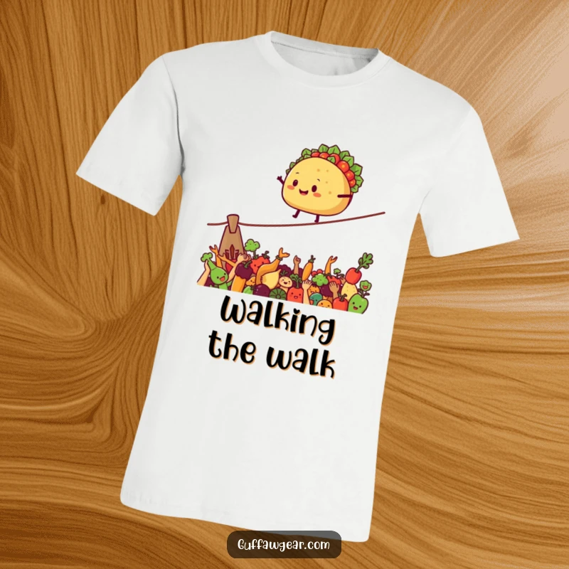 Funny T-Shirt showcasing a smiling taco on a tightrope over cheering vegetables, perfect for food lovers.