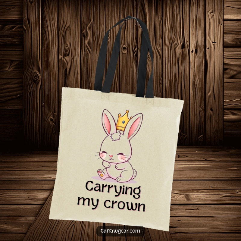 Funny Rabbit Tote Bag showing a cute rabbit in a tiny crown, comically tripping over its ears, perfect for shopping.